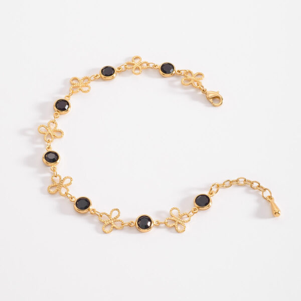 Pulsera de flores con filigrana y piedras negras a la moda