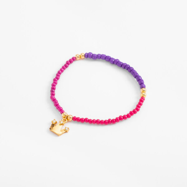 Pulsera en baño de oro con abalorios magenta fucsia morado